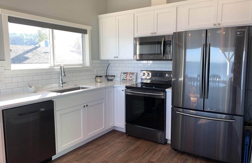 Camano Island House | Beachfront home with kayaks, SUP, firepit, great deck, AC and more!