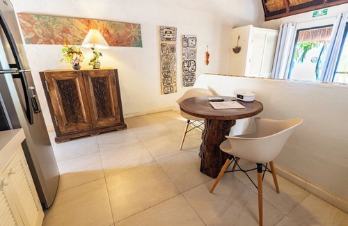Isla Mujeres Cottage | Beachfront palapa cottage with heated pool , sunsets and tropical gardens