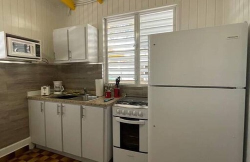 El Combate Cabin | Beachfront Rustic Cabin by Sunset Village - Yellow