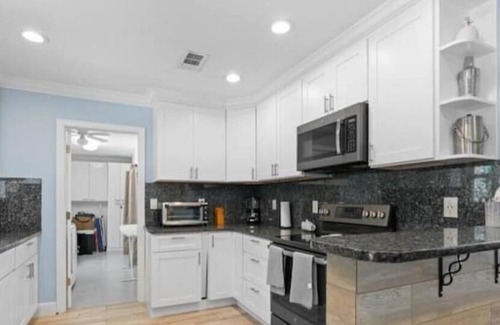 Jupiter House | Beautiful 4 bd-2 bath getaway with grill & crib and just minutes from the beach.