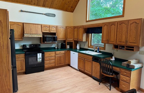 Hancock County Ski Chalet | Beautiful beachfront chalet with southern exposure on Green Lake,Dedham, Maine.