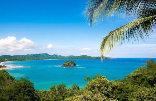 Playa Flamingo House | Beautiful Condo in Peaceful Cliffside Location with a Private Balcony & Stunning Ocean and Mountain Views