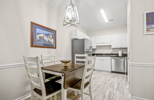 Vaught Condo | Beautiful condo with pool. 5 minute drive to beach. Sleeps 8. Pet friendly