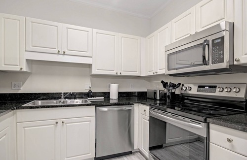 Vaught Condo | Beautiful condo with pool. 5 minute drive to beach. Sleeps 8. Pet friendly