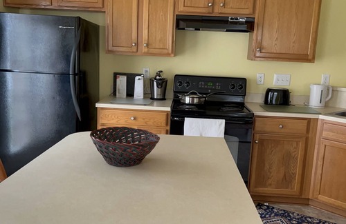 Charlotte House | Beautiful end unit vacation home for short term rental with adequate sunlight.