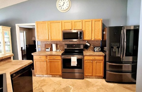 Port Saint Lucie House | Beautiful Home in East Port St Lucie. Heated and Screened Saltwater Pool