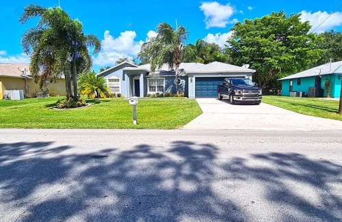 Port Saint Lucie House | Beautiful Home in East Port St Lucie. Heated and Screened Saltwater Pool