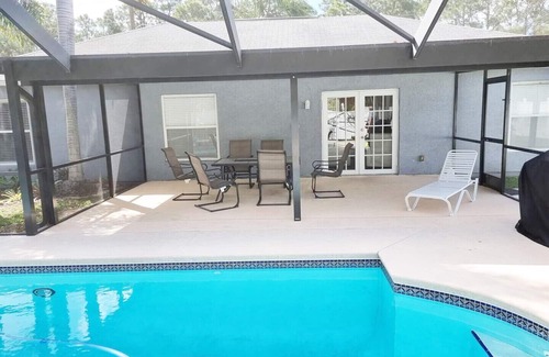 Port Saint Lucie House | Beautiful Home in East Port St Lucie. Heated and Screened Saltwater Pool