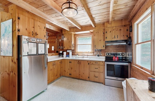 Beaver Cove Cabin | Beautiful home with WiFi, lake view, deck, & firepit - walk to beach