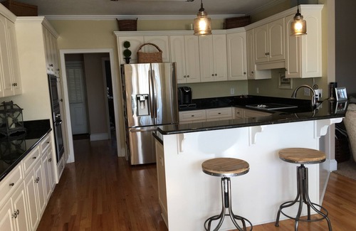 Evans House | Beautiful Masters Rental with pool & tropical landscaping