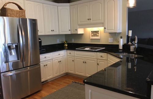 Evans House | Beautiful Masters Rental with pool & tropical landscaping