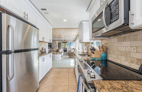 Southold House | Beautifully appointed waterfront property with heated pool and cabana