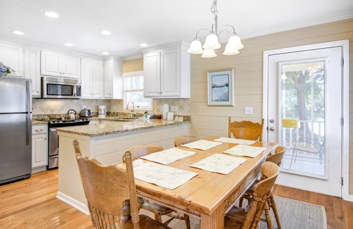 Pelican Bay House | Beautifully decorated cottage steps from the beach with pool & open layout