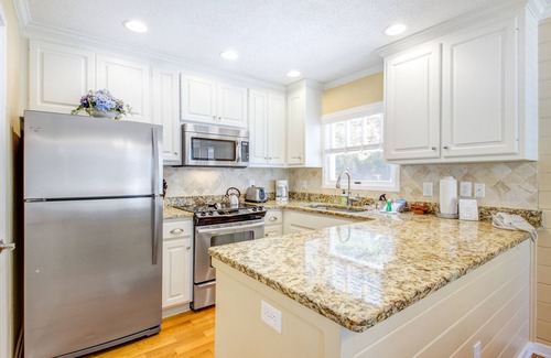 Pelican Bay House | Beautifully decorated cottage steps from the beach with pool & open layout