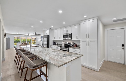 Shell Harbor House | Beautifully newly redesigned canal front pool home minutes to beach! NEW!