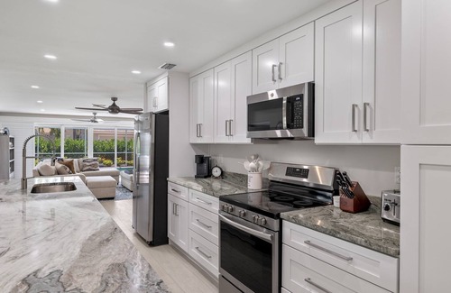 Shell Harbor House | Beautifully newly redesigned canal front pool home minutes to beach! NEW!