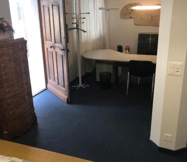 Zug House | Bedroom cum office with shared shower in Zug's Old Town