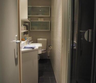 Zug House | Bedroom cum office with shared shower in Zug's Old Town