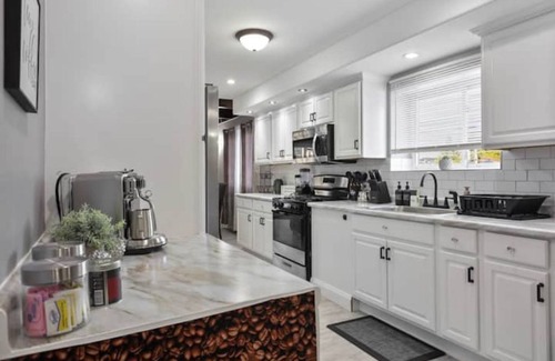 Belmont Cragin Apartment | Belmont Pleasures - hot tub/arcade gaming room