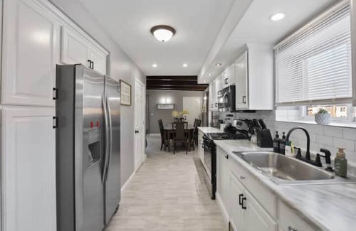 Belmont Cragin Apartment | Belmont Pleasures - hot tub/arcade gaming room