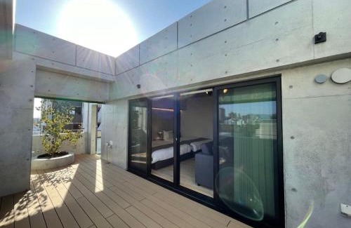 Hiroshima City Centre Apartment | bHOTEL Nekoyard - Scenic Penthouse Studio with Jacuzzi & Spacious Terrace