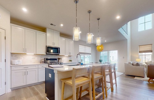 Millville Villa | Bishop's Landing new villa with EVC, fireplace, outdoor pool, gym, and tennis