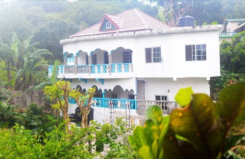 Fairy Hill House | Blue Balcony Room at Robin Hood guest house