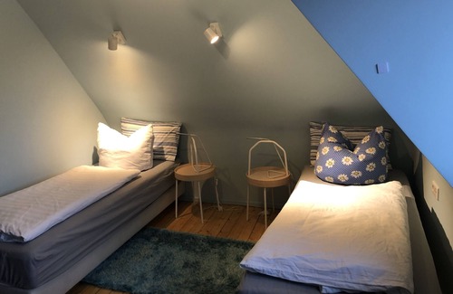 Mainstockheim House | Blue Room with balcony: remodeled historical room of a school teacher with bath