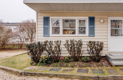 Montauk House | Bohemian-style hotel unit with ample natural light, a cozy seating area,.