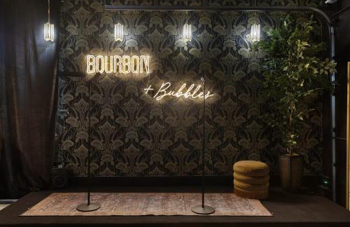 Katie Hill Neighborhood House | Bourbon & Bubbles - Rooftop Hot Tub & Speakeasy