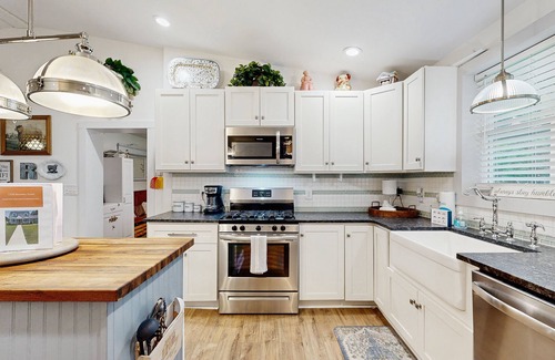 Hanahan House | Breezy, renovated home with fenced yard, front porch & lovely living spaces