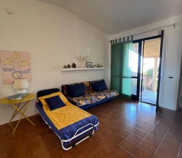 Rena Majore House | Bright holiday home with veranda and sunset over the sea