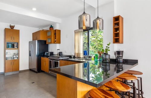 Conchas Chinas Condo | Bright ocean-view 2-story condo near beach with pool, balcony & full kitchen
