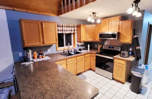 Garrison House | Brown Bass Cabin -Immersed in nature surrounded by mature trees.