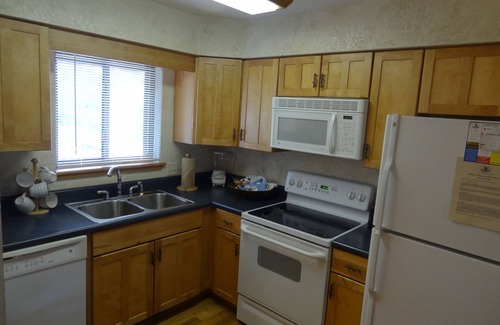 Mount Ida Cottage | C16, Two bedroom, two bath, log-sided Harbor North luxury cottage with hot tub overlooking Lake Ouachita. by RedAwning