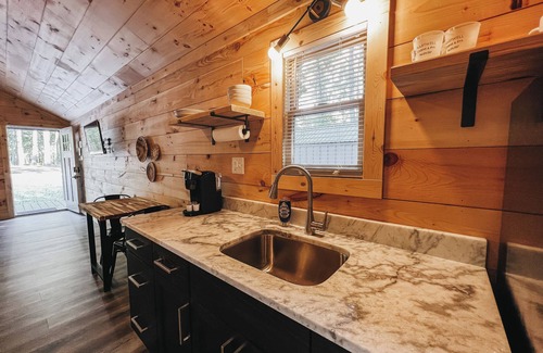Hartwell Apartment | Cabin #1: Studio style layout with kitchenette and a large gravel parking pad beside the cabin for easy boat or trailer storage.
