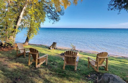 Suttons Bay House | Cabin-style home near Suttons Bay. West Bay beachfront. Fireplace. Central AC