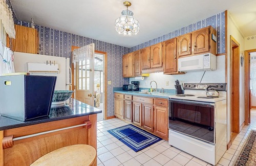 East Wakefield House | Calming dog-friendly lake view home with firepit, wood stove, patio, & gas grill
