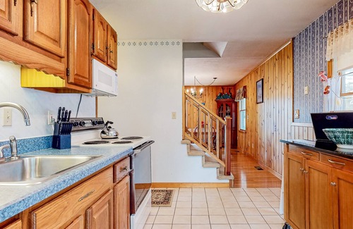 East Wakefield House | Calming dog-friendly lake view home with firepit, wood stove, patio, & gas grill