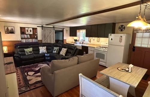 Tylersburg House | Camp Bear Bottom is a lovingly kept 1950s cabin where families gather to unplug and reconnect. Step inside to find an inviting indoor fireplace, fast Wi-Fi, and a fully equipped kitchen ready for your favorite recipes.