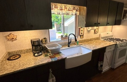 Tylersburg House | Camp Bear Bottom is a lovingly kept 1950s cabin where families gather to unplug and reconnect. Step inside to find an inviting indoor fireplace, fast Wi-Fi, and a fully equipped kitchen ready for your favorite recipes.