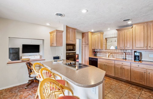 Edgewater House | Canal-front home with deep-water dock, pool, lanai, & central AC - snowbirds OK