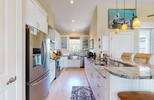 Cape Haze House | Canal-side monthly rental with private dock, heated pool, kayaks, & beach access