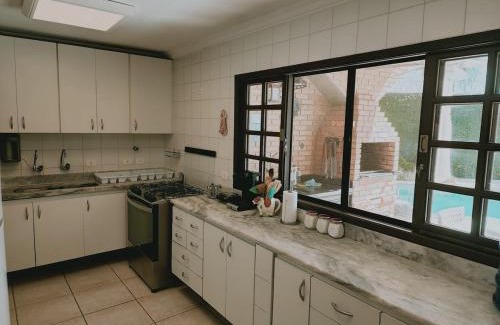 Jardim Virginia House | Casa com piscina alto padrão