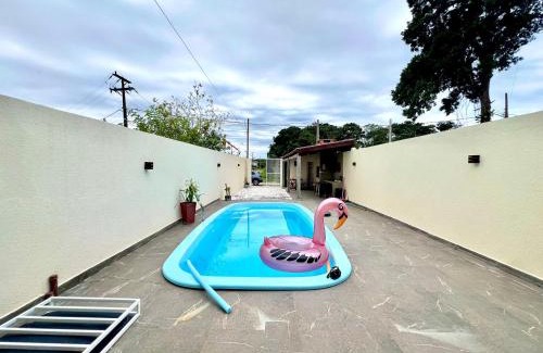 Guaratuba House | Casa com piscina , ar condicionado e churrasqueira no balneário Eliana