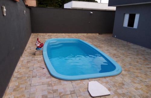 Peruibe House | Casa com piscina em condomínio fechado