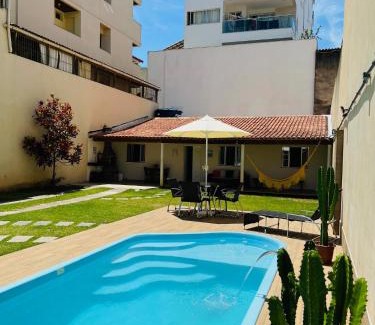 Praia do Morro Apartment | Casa de Praia com Piscina, quintal, lazer e churrasco, 3 quartos com ar condicionado, sendo 2 suites para sua familia!
