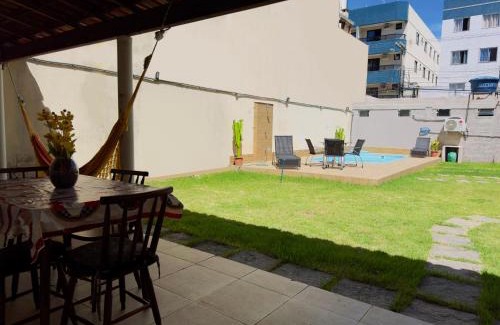 Praia do Morro Apartment | Casa de Praia com Piscina, quintal, lazer e churrasco, 3 quartos com ar condicionado, sendo 2 suites para sua familia!