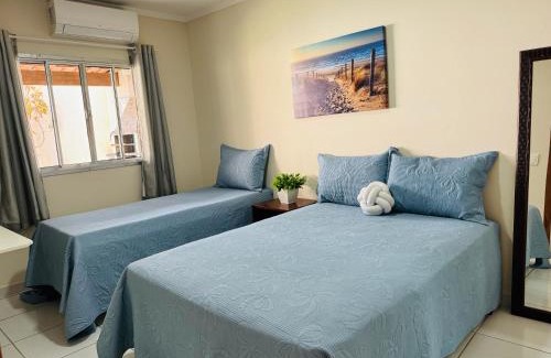 Praia do Morro Apartment | Casa de Praia com Piscina, quintal, lazer e churrasco, 3 quartos com ar condicionado, sendo 2 suites para sua familia!
