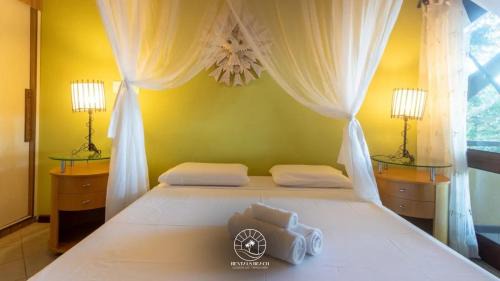 Arraial d'Ajuda House | Casa em Arraial D'ajuda - Praia do Mucugê - Bahia - 40mts da praia - Ar condicionado - Churrasqueira - Smart Tv - Wifi - Piscina - Vaga para carro
